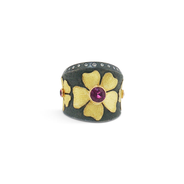 flower ring with purple and pink sapphires and flush set diamonds